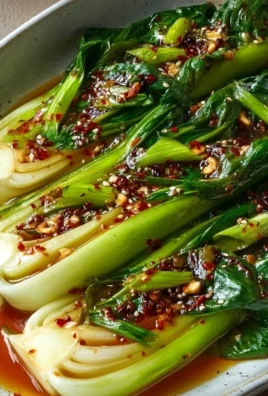 Bok Choy stir-fried with ginger chili sauce, garnished and ready to serve.