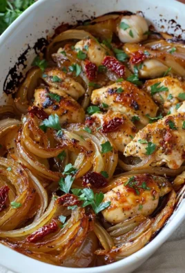 Baked chicken topped with sweet caramelized onions for a flavorful dish.