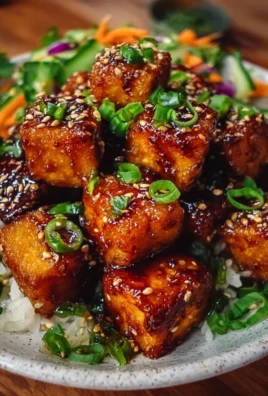 Delicious crispy honey garlic tofu served with vegetables