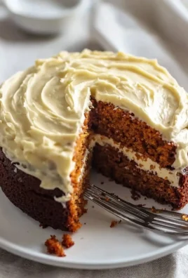 Delicious easy carrot cake with cream cheese frosting on a plate