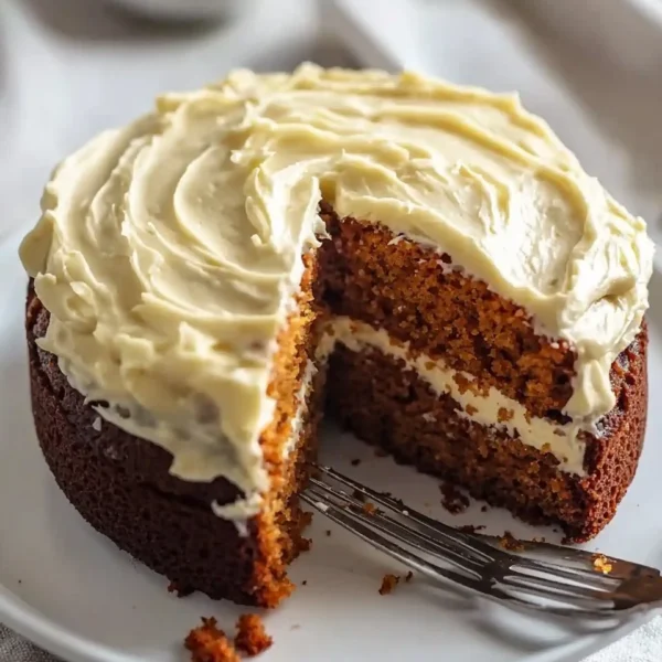 Delicious easy carrot cake with cream cheese frosting on a plate