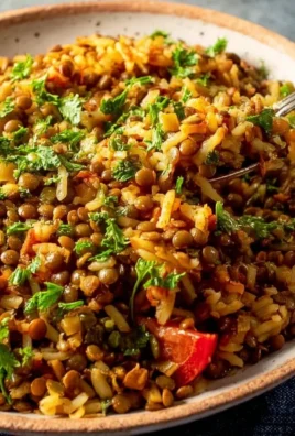 Bowl of easy Mediterranean lentils and rice dish garnished with fresh parsley