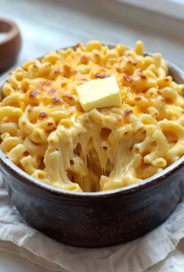 Bowl of easy no-roux, no-egg Mac & Cheese topped with breadcrumbs.