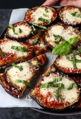 Delicious homemade eggplant pizza topped with fresh ingredients.