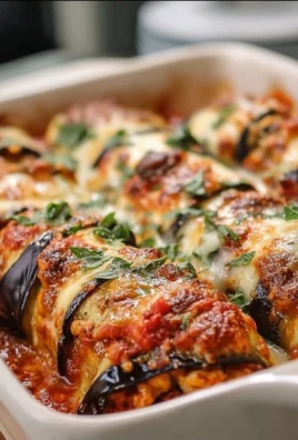 Delicious fluffy eggplant rollatini bake topped with cheese in a baking dish