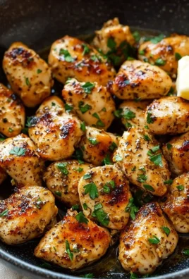 Garlic Butter Chicken Bites served on a plate garnished with herbs