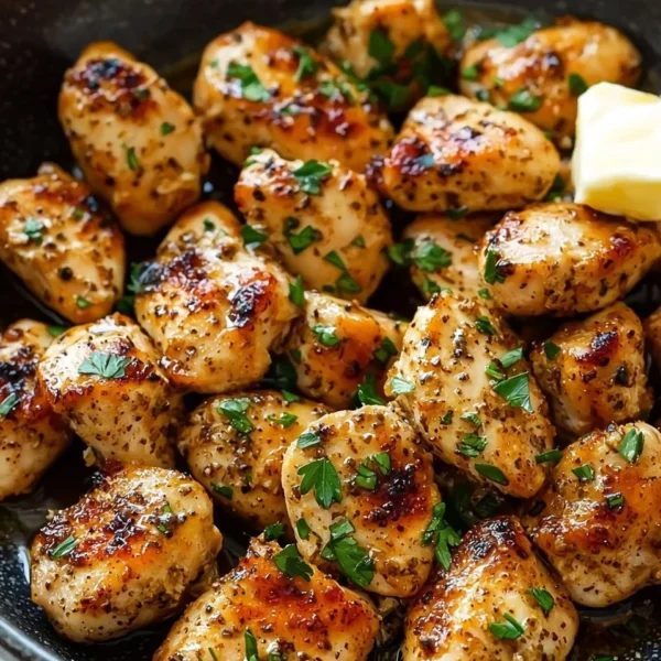 Garlic Butter Chicken Bites served on a plate garnished with herbs