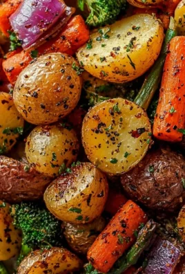 Plate of garlic herb roasted potatoes and mixed vegetables