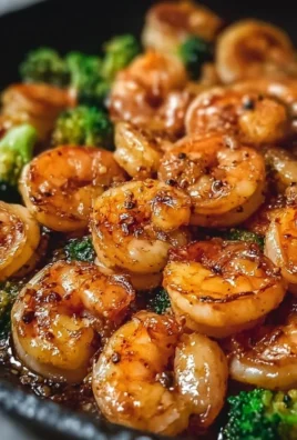 High-protein honey garlic shrimp served with vegetables on a plate