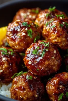 Honey Garlic Turkey Meatballs served with a savory sauce and garnish.