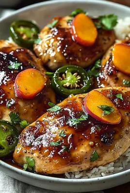 Jalapeño Peach Glazed Chicken served on a plate with garnish