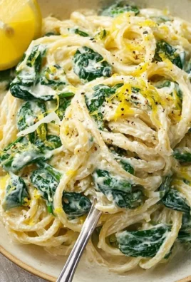 Lemon ricotta pasta with fresh spinach in a creamy sauce