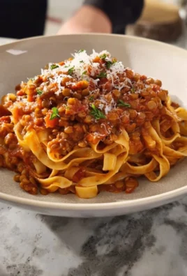 Bowl of flavorful Lentil Bolognese with herbs and spices