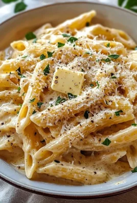 One Pot Creamy Garlic Pasta topped with herbs and parmesan cheese.