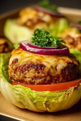 Oven-baked cabbage burgers served on a plate with fresh toppings