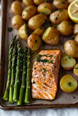 Salmon, potato, and asparagus sheet pan meal cooked and ready to serve