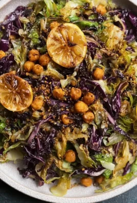 Shredded hispi cabbage and charred lemon salad in a bowl