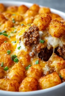 Delicious Tater Tot Casserole topped with ground beef and cheese