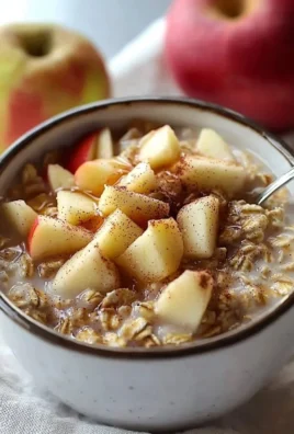 Delicious bowl of Apple Cinnamon Overnight Oats topped with fresh apple slices and cinnamon