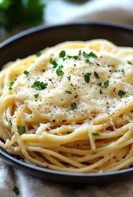 Plate of cheesy garlic parmesan spaghetti garnished with fresh parsley