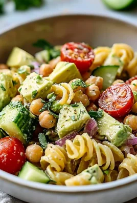 High protein vegan avocado pasta salad with fresh ingredients and vibrant colors