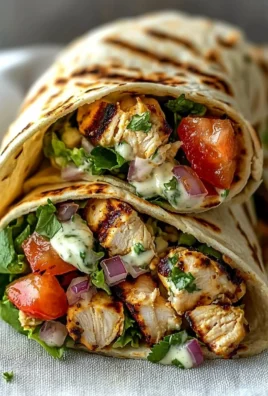 Delicious creamy grilled chicken wrap served with fresh ingredients