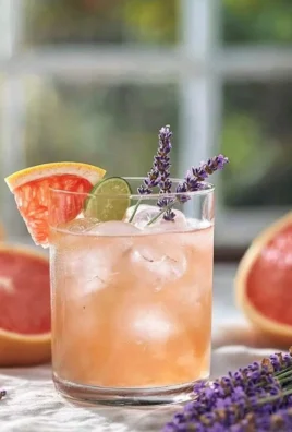 Lavender Dove perched on a branch showcasing its beautiful lavender feathers.