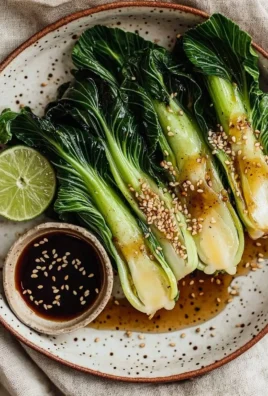 Sautéed baby bok choy with ginger sauce served in a bowl